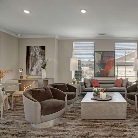 The interior of the Clubhouse at Indigo Apartments with couches and chairs