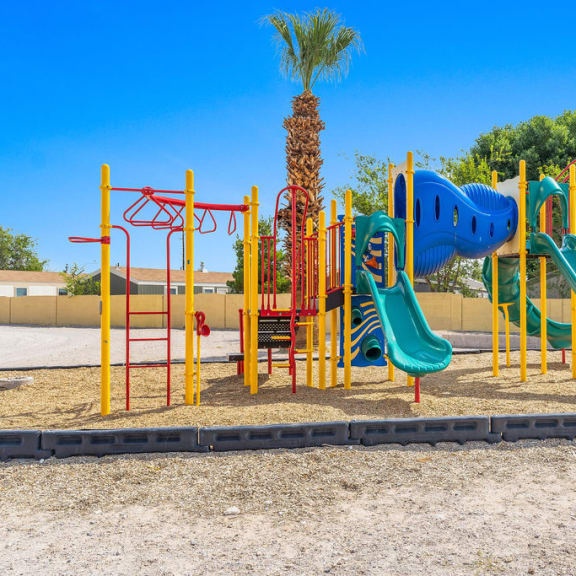 a playground with two slides and two monkey bars