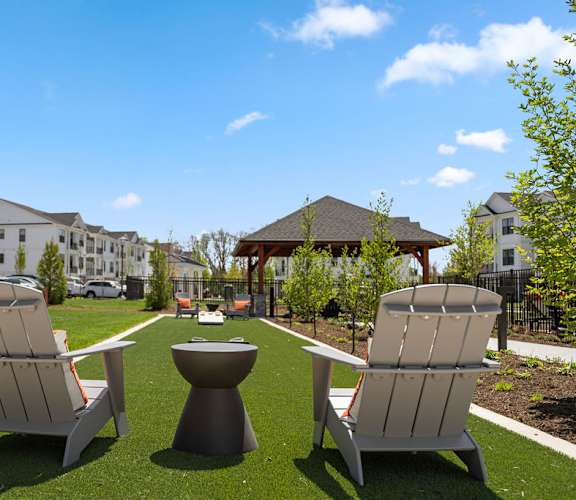 two lounge chairs and a fire pit in a park at Madison Prickett Preserve, Pennsylvania