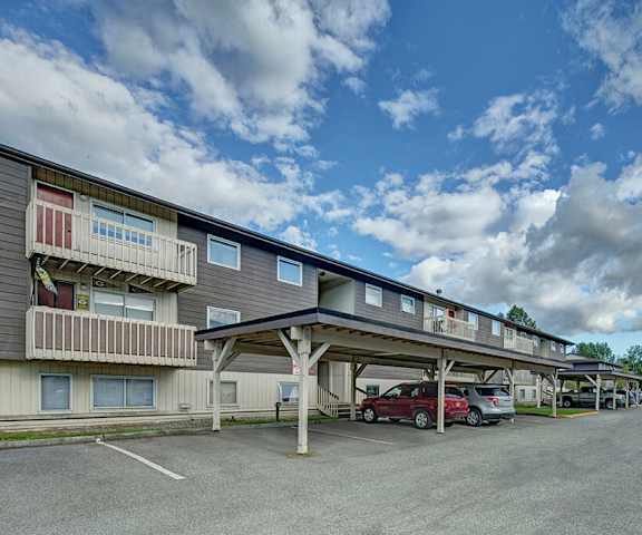 The exterior of the buildings and covered parking lot at the Legacy Apartment Homes.