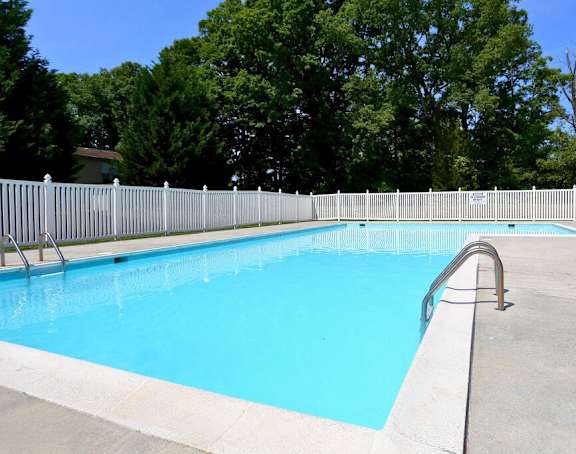 a swimming pool with a fence around it