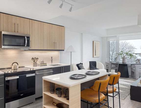 a kitchen and dining room with a table and chairs