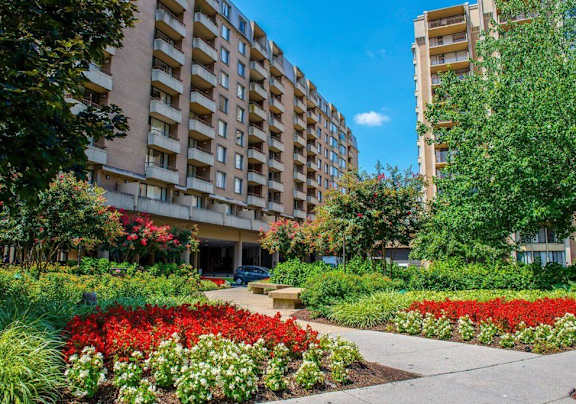 A building with a garden in front of it.