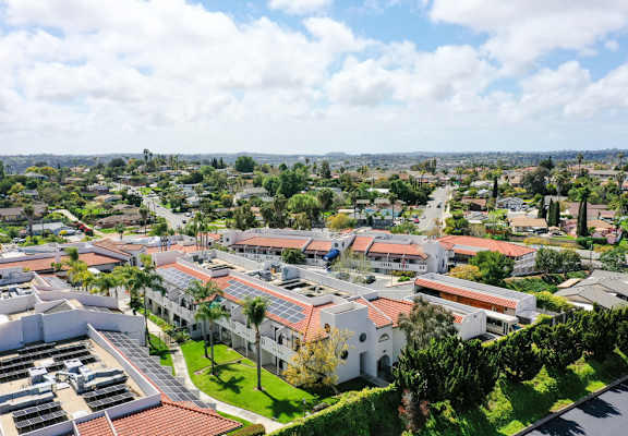 A view of a residential area with houses and buildings.