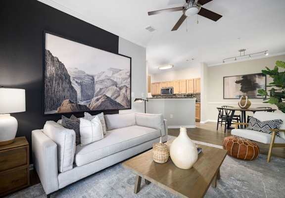 a living room with a white couch and a coffee table