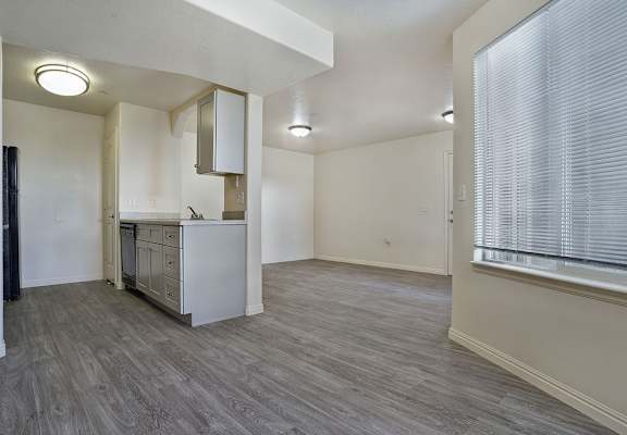 A kitchen area with a refrigerator, oven, and microwave.