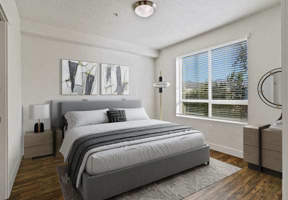 a bedroom with a bed and a window
