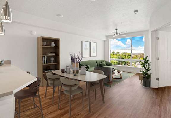an open living room and dining room with a table and chairs