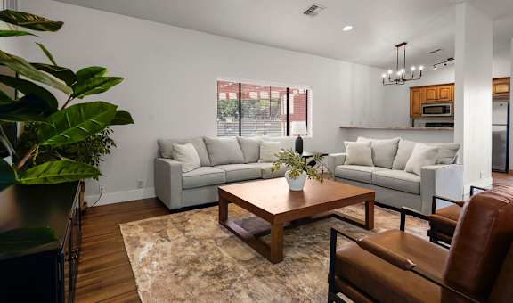 a living room with couches and a table