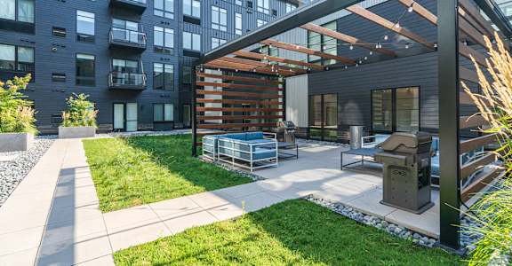 Courtyard Pergola with Grill and Seating