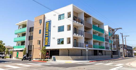 A multi-story building with the words "Non-Leasing" on the side.