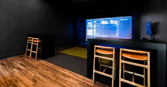 A room with a bar and two chairs at Evolve St. James Apartment Homes Apartments, Southport, NC, 28461
