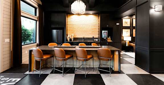 A black and white checkered floor in a modern kitchen at Evolve St. James Apartment Homes Apartments, Southport, NC, 28461