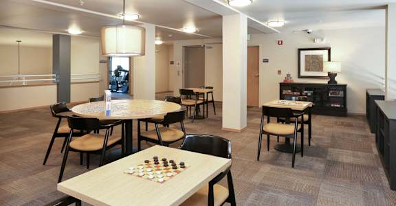A room with a chess board and chairs at VINTAGE AT BELLINGHAM, Bellingham, WA