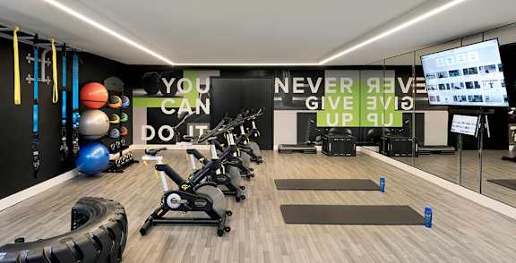 Fitness center spin studio at Chromatic Flats Apartments in San Diego CA