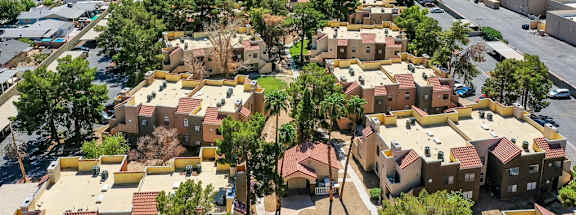A bird's eye view of a residential area with houses and trees.