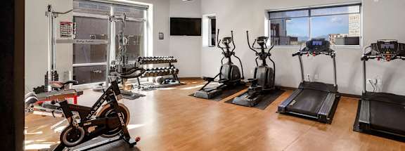A gym with treadmills, exercise bikes, and other equipment. at Wilmington Flats Apartments, Salt Lake City, UT, 84106
