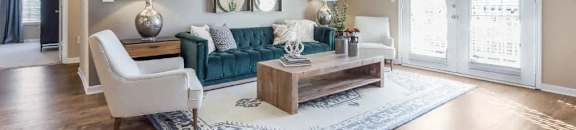 a living room with a couch and a ceiling fan at Reserve at Gulf Hills Apartment Homes in Ocean Springs, Mississippi