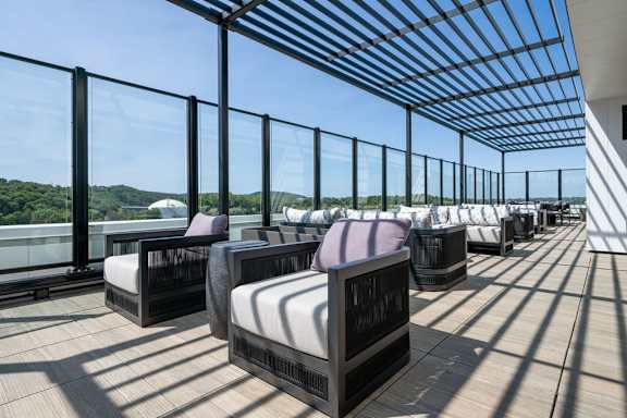 a spa area with spa beds and a view of the water and mountains