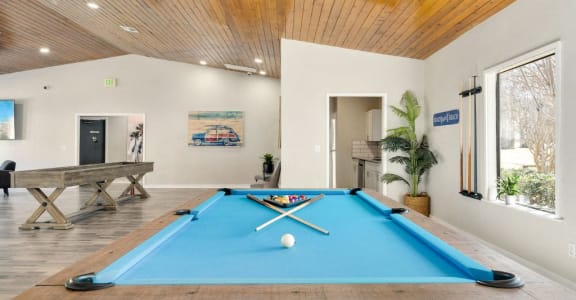 a pool table in a living room with a ball
