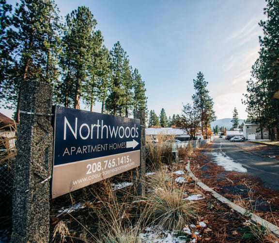 a sign that reads northwoods apartments