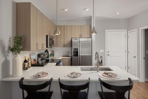 Kitchen with white countertops at Alta Davis apartments in Durham, NC