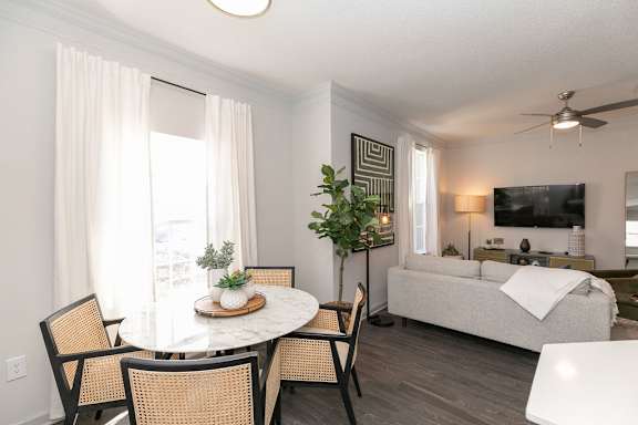 an open living room with a couch and a tv at Willowest at Lindbergh in Atlanta, Georgia