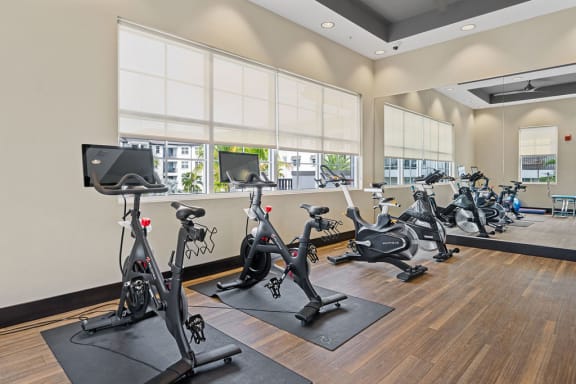 a gym with exercise bikes and other fitness equipment at Inspira, Florida, 34113