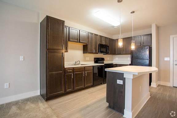 Kitchen with Wooden Cabinets at Stone Springs Apartments, Sterling, VA, 20166