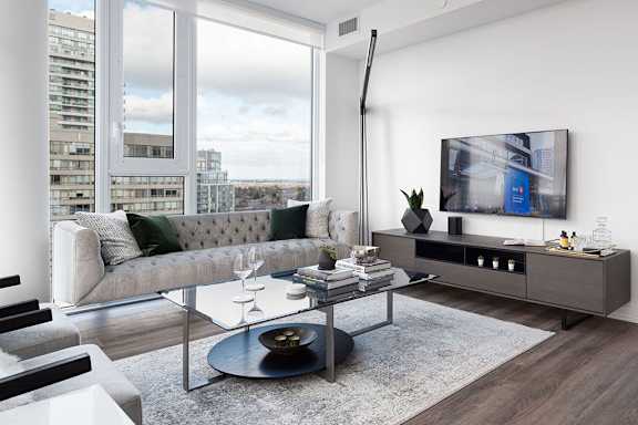 a living room with a couch and a table and a television