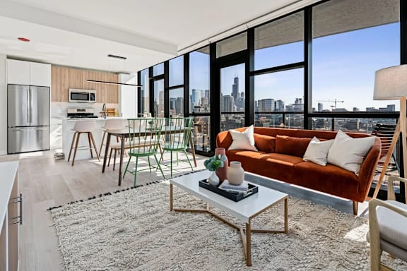 A modern living room with a view of the city skyline.
