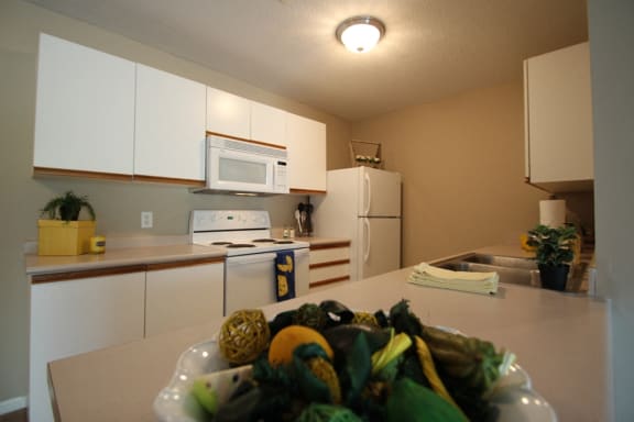 This is a photo of the kitchen of a 1245 square foot 2 bedroom apartment at Cambridge Court Apartments in Dallas, TX.