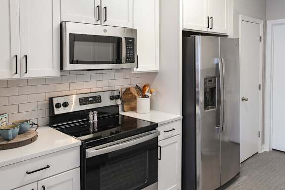  Newly renovated suites include quartz countertops, stainless steel appliances and matte black finishes and hardware (Legacy Series)