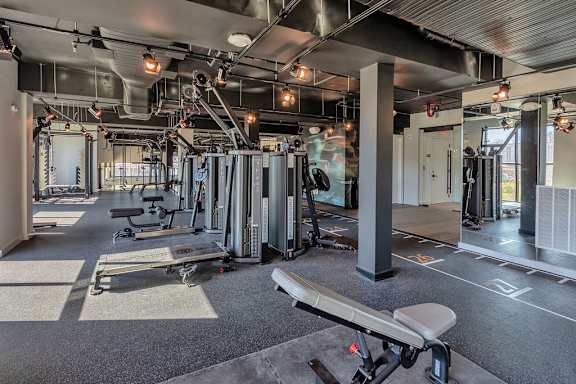 Bi-level fitness studio with weight machines