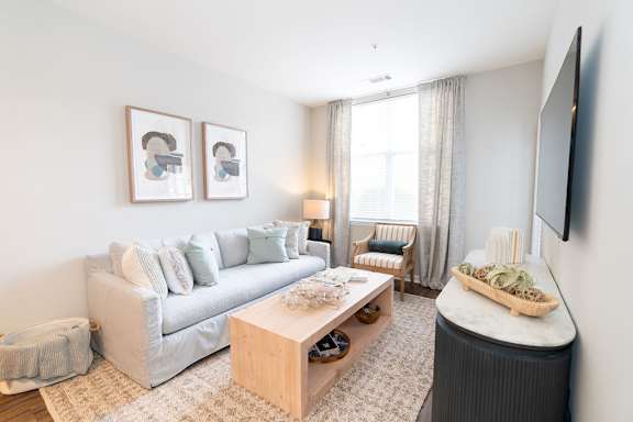 a bedroom with a bed and a ceiling fan