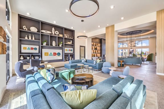 a living room filled with furniture and a large window