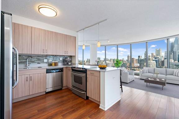 A kitchen with a white sink and a white refrigerator.