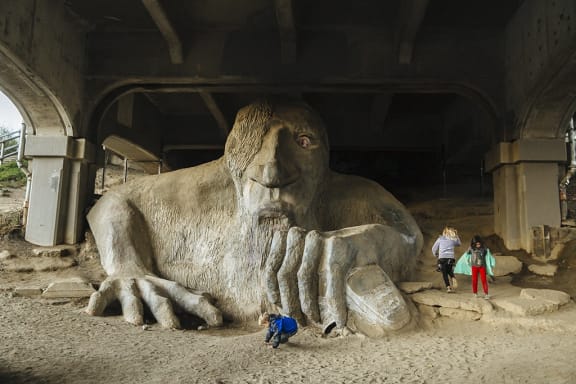 people looking at the foot of a giant statue of a gorilla at The Hayes on Stone Way, Seattle, WA, 98103