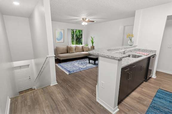 Kitchen and living room at Running Brook Apartments in Miami FL