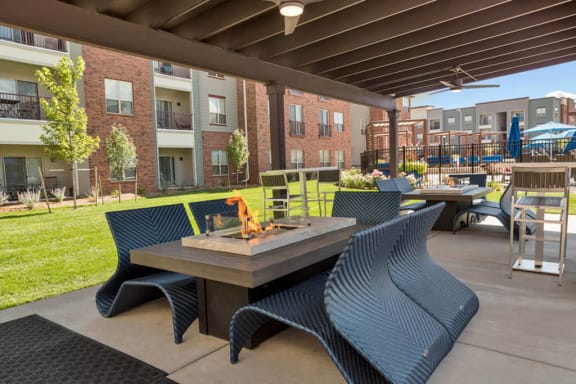 Westlake Greens Firepit with black chairs around it