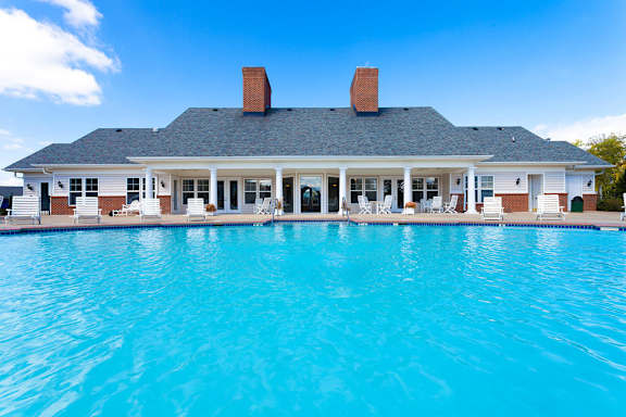 Daytime image of pool and clubhouse