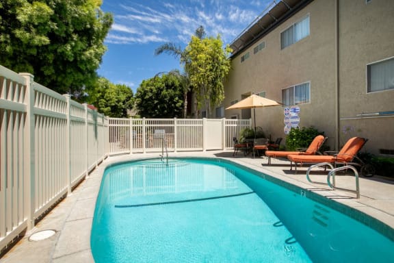 Apartments for Rent in West Hills, CA - Topanga - Pool with Lounge Chairs and Fence.