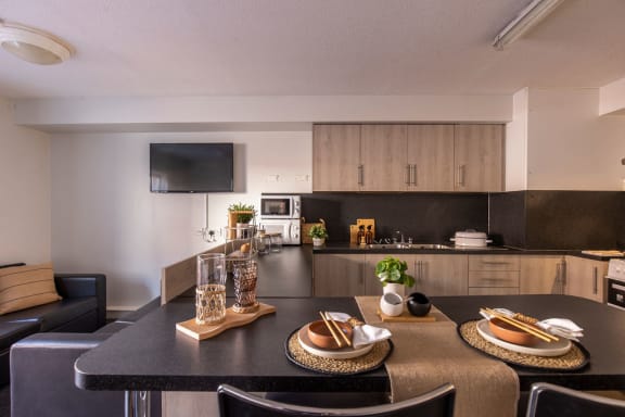 a kitchen and dining area in a 555 waverly unit