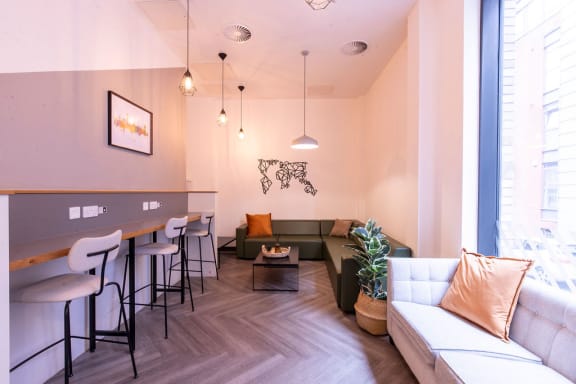 a living room with a couch and a bar