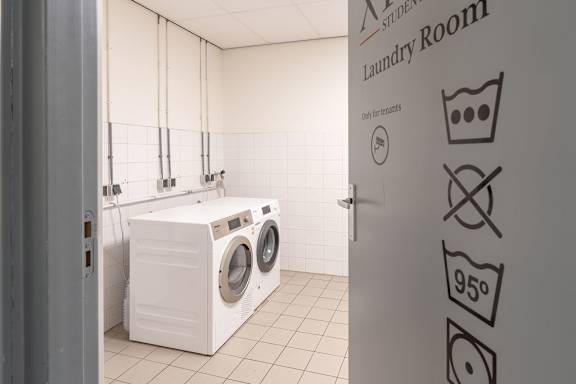A laundry room with a washer and dryer.