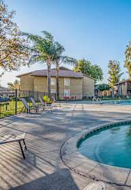 A round above ground pool with a fountain in the middle.