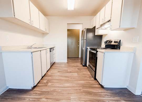 Lakewood Apartments - Arbor Pointe Apartments - Kitchen and Entryway, from Dining Room