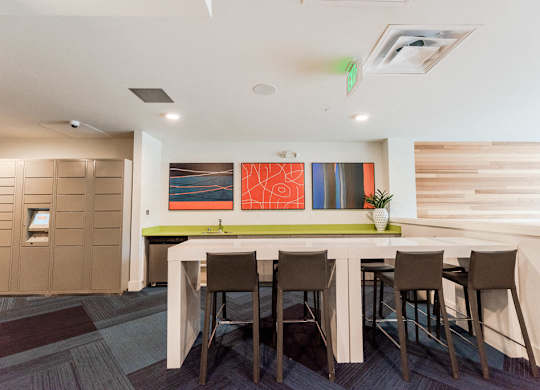Seattle, WA Apartments for Rent - Icon Apartments Resident Lounge with Flat Screen TV and Cozy Table Seating at Icon Apartments, Seattle