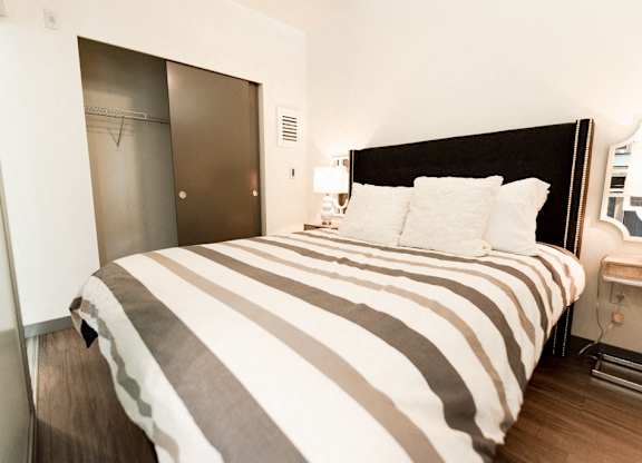 Two Bedroom Apartments in Seattle, WA - Icon Apartments Bedroom with Hardwood Floors and Large Closet at Icon Apartments, Seattle, Washington