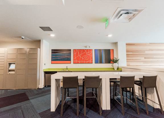 Seattle, WA Apartments for Rent - Icon Apartments Resident Lounge with Flat Screen TV and Cozy Table Seating at Icon Apartments, Seattle